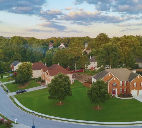 Aerial shot of defined curve in North Metro Atlanta neighborhood and deep green grass.